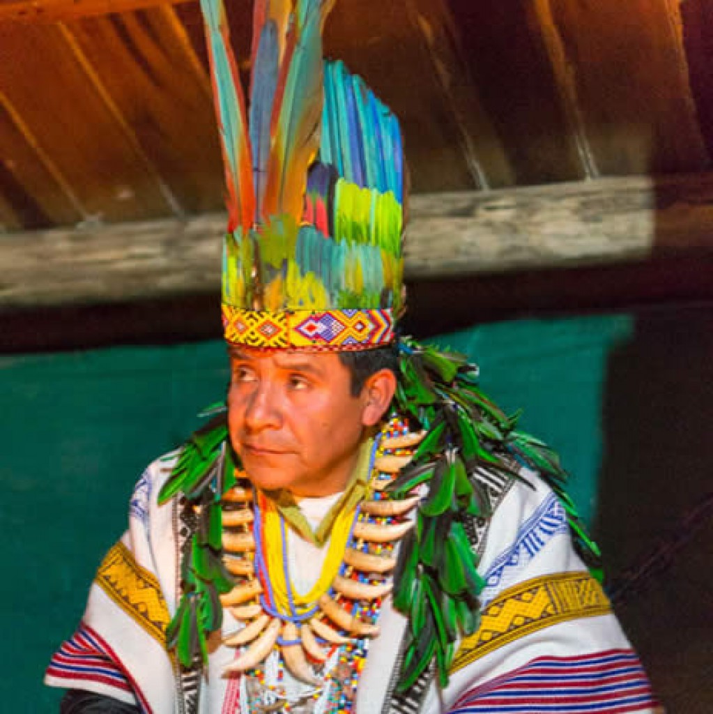 Taita Juan Mutumbajoy - Kamsa shaman conducts healing ceremony inside the Moloka. Waira Sacha (place where the wind is born) healing centre, near Sibundoy, upper Putumayo basin, the centre of Brugmansia shamanism, Colombia. Â© Pat Morrow