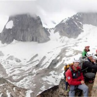 Our team enjoys the view of Snowpatch and Bugaboo Spires from atop East Post Spire (Baiba on right). © Pat Morrow