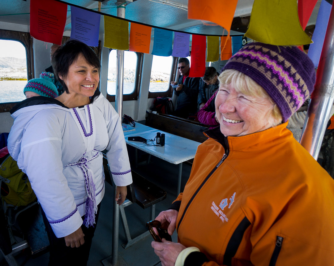 Throat singer Evie Mark and Park Superindendent Judy Rowell aboard the Inuttatik boat, Torngat Mountains National Park , Northern Labrador Mountains, (Newfoundland and Labrador), Canada