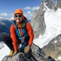 ACMG guide Jen Olson crosses the "au cheval" pitch near the top of Pigeon Spire during the Bugaboos Teens 2013 climbing camp organized by the Conrad Kain Centennial Society.