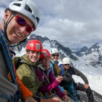 ACMG guide Kirk Mauthner, Ethan Vandenbrink, Shannon Ryan, Micaela Mauthner and Koeye McAllister atop Pigeon Spire during the Bugaboos Teens 2013 climbing camp organized by the Conrad Kain Centennial Society.