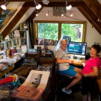 Betty and Colin Monteath in action in the office of Hedgehog House and Barking Mad Books at their home in Christchurch, NZ