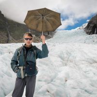 An umbrella is the tool of choice on the Fox Glacier, Alpine Guides, Fox Glacier, Tai Poutini National Park, New Zealand (Marius Bron and son)