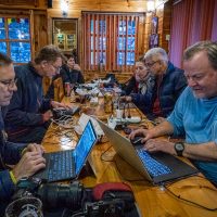 ACC Nepal Photo workshop review their day's shoot at Sherpa Guide lodge in Phakding