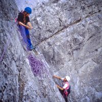 Baiba, and Haruko Nagano rock climb on "Sideline" route, Crag X, near Canmore, AB - 645 format