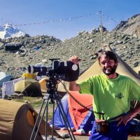 Pat at north base camp of Everest filming "Climb for Hope" for a Canadian Everest expedition of the same name. Tibet. 1991.