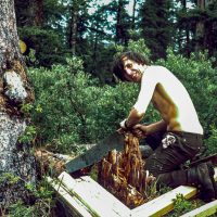 Archie Simpson during repair of "Simpson" hut CMC Valley behind Yam c 1972Calgary Mountain Club