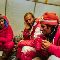 Canadian Mount Everest Expedition 1982. Peter Hillary and Bill March listen as Laurie Skreslet calls down his success story to base camp